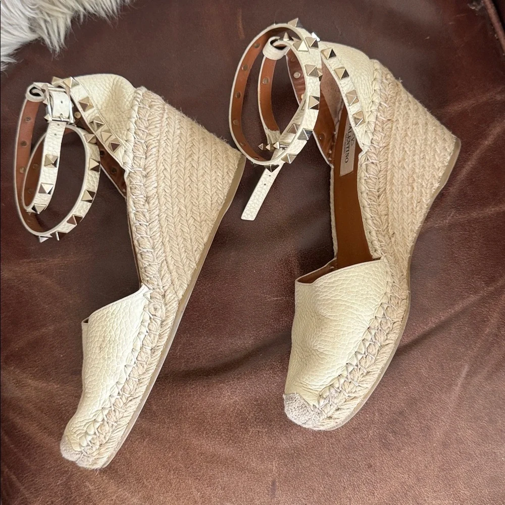 These are Valentino Garavani Rockstud textured-leather espadrille wedge heel